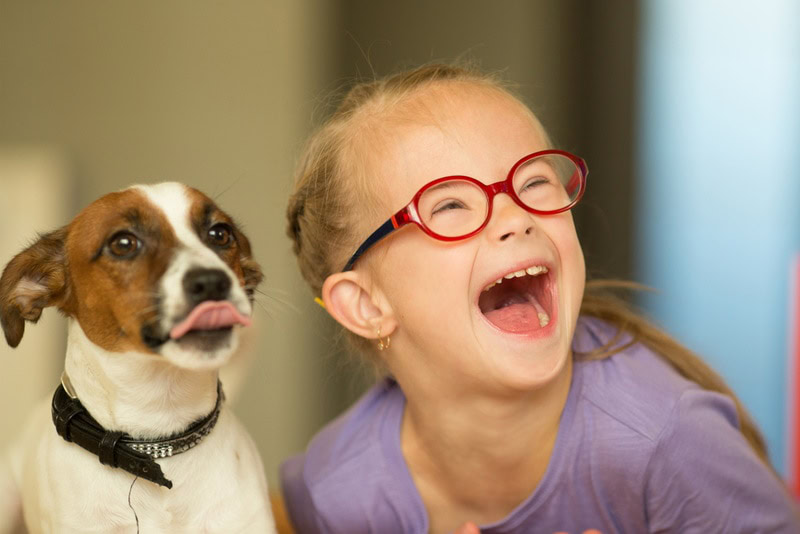 Girl with Autism with her pet dog