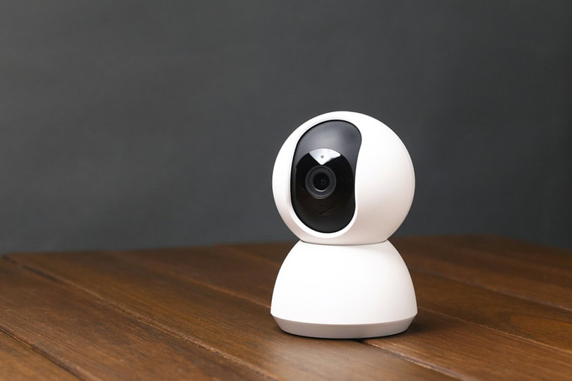 a smart camera on wooden table