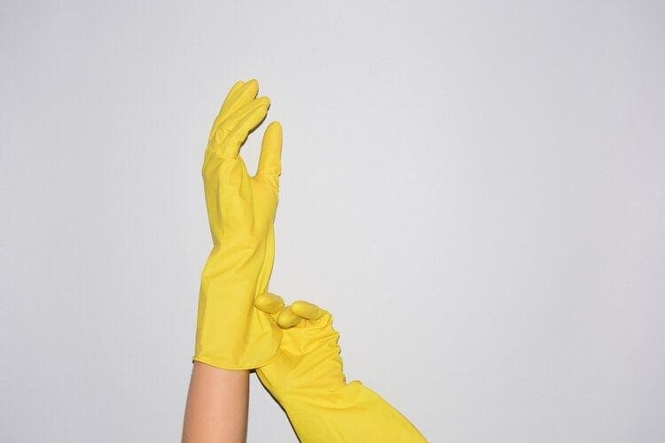 rubber gloves worn on hands